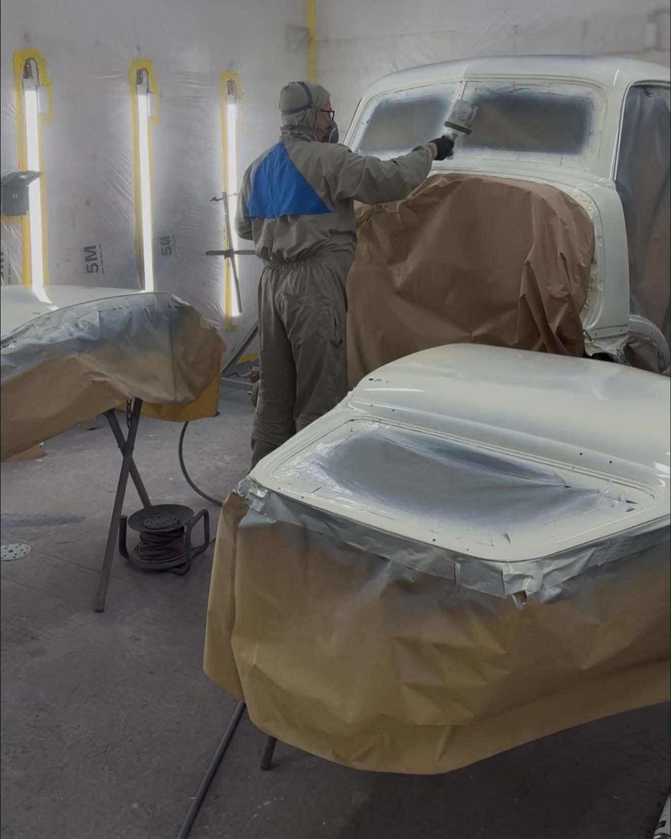 Classic vehicle masked and prepared in the spray booth